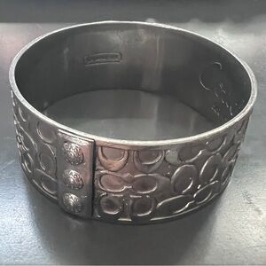 Coach Wide Polished Silver Signature “C” Bangle 1”